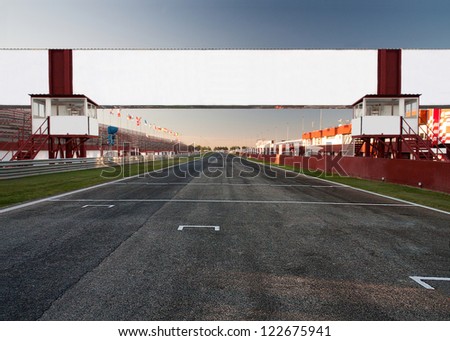 a racetrack with an empty board, for filling with text o logo. It can be used as conceptual business picture. Focus is on the board