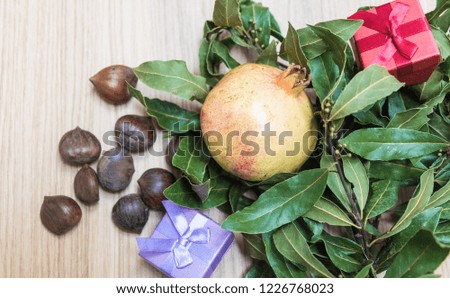 Fall and winter seasonal background, with chestnuts and pomegranate