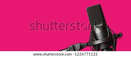 professional condenser microphone isolated on pink background