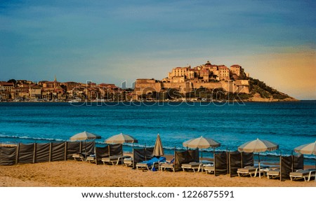 View of citadel with houses in Calvi bay, Corsica island, France. Beautiful travel picture of famous turist destination.