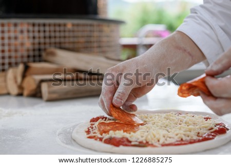Concept picture of home made pizza making with fresh ingredient