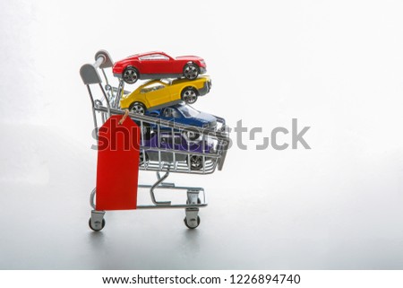 car in shopping cart with tag 