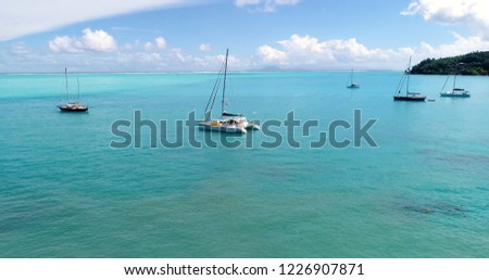 boat in a lagoon in aerial view, French Polynesia