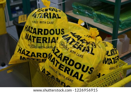 Laboratory hazardous material waste waiting for disposal.