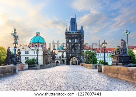 Charles Bridge leading to the Old Town Bridge Tower and St. Francis of Assisi Church, Prague, no people Royalty-Free Stock Photo #1227007441