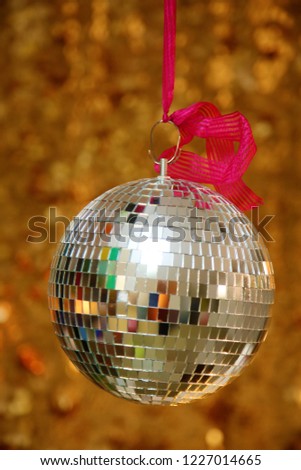 Silver Mirror Ball with Gold Sequin Background. Disco Ball with Gold backdrop. Disco Party. Dance Party. 