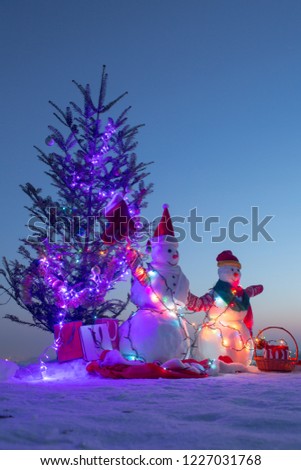 Family holiday. Happy New Year. Merry Christmas. Christmas tree and snowman. Santa hat. Winter traditions. New Year 2019. December. Santa Claus costume