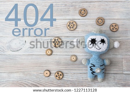 Error 404. Knitted beautiful robots of white and blue threads. Concept. Handmade. Education.