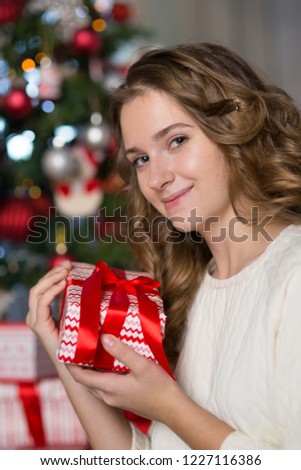 Teen girl in the room decorated for Christmas