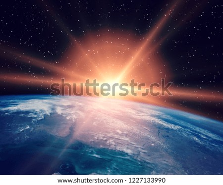 Earth from space during a sunrise. The elements of this image furnished by NASA.
