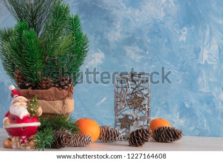 Christmas composition of Christmas objects with a Christmas tree and a snowman. New Year's decoration. Tangerines with persimmon. Christmas.