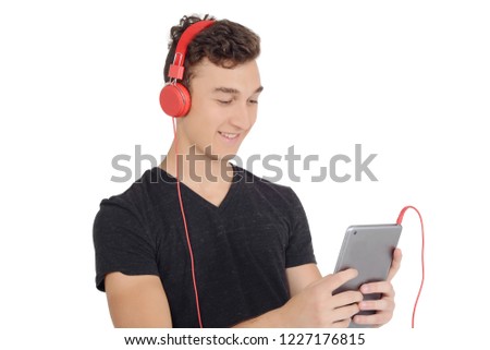 Teenage boy using tablet with headphones. Technology concept. Isolated white background