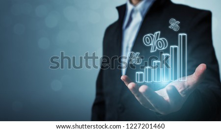 Interest rate financial and mortgage rates concept. Businessman hand show icon percent 3d sign with graph indicator