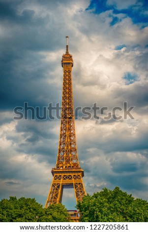 Eiffel Tower at sunset in Paris, France. Romantic travel background. Eiffel tower is traditional symbol of paris and love. HDR