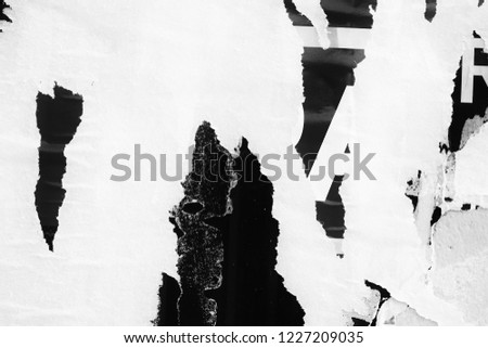 Old grunge ripped torn vintage collage posters creased crumpled paper surface placard texture background backdrop empty space for text letter