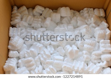 Foam popcorn cushioning material in shipping.