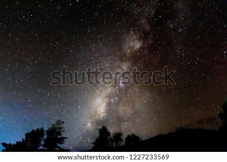Milky Way in the darkest night with beautiful mountain shape.