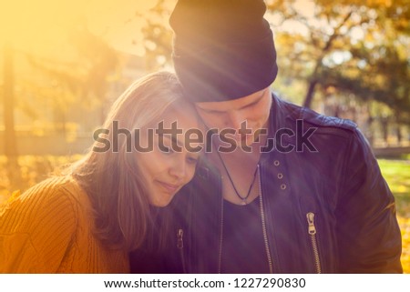 Beautiful young couple in love. Golden autumn in the park, girl on the background of natural sunlight, happy newlyweds, Boyfriend, toned