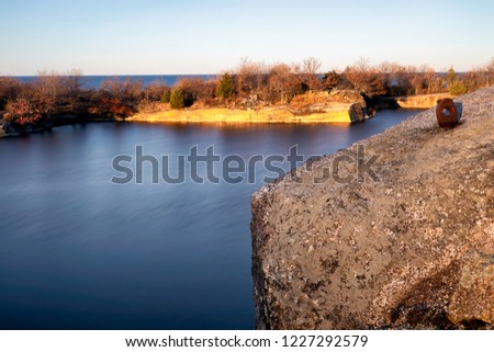 A rock quarry at sunset with golden light