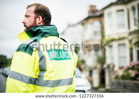 Portrait of a male paramedic in uniform Royalty-Free Stock Photo #1227327106