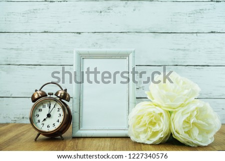 vintage alarm clock and space photo frame
