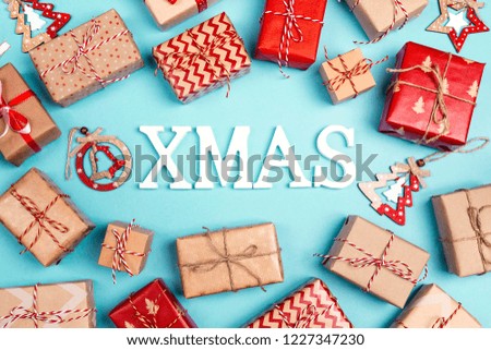 Christmas background with many gift boxes on blue. Top view.