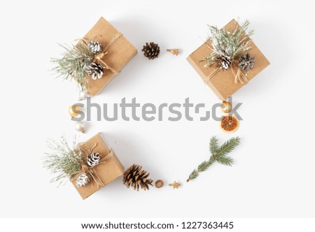 Christmas background. Wreath made of Christmas decoration on white background top view. New year flat lay