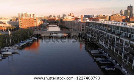 Milwaukee river in downtown, harbor districts of Milwaukee, Wisconsin, United States. Real estate, condos in downtown. Aerial view, drone flying