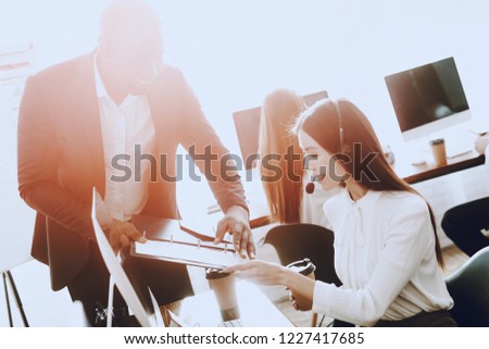 Team of Managers Working in Modern Call Center. Manager with Computer. Businessman on Workplace. Consultant with Microphone. Customer Service Concept. Woman in Headphones. Operator in Office.