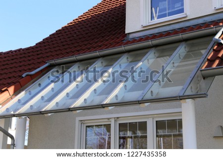Glass canopy front door