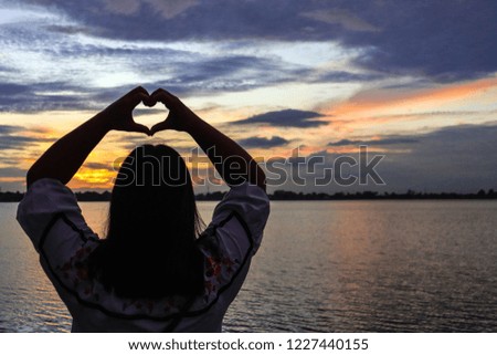 Back person  hand heart in love