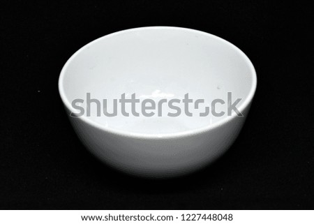 White curry soup bowl on black background