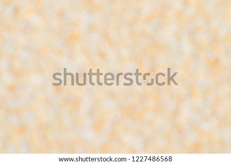 Blurry of golden sand beach,concept is beautiful nature background for artwork design about festival celebrate such as new year,Christmas, Valentine, parties, carnival,website template.
