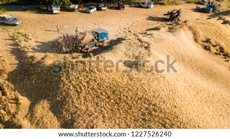 Transport of Traditional Combine Operator Harvesting Corn on the Field in Summer Evening at North of Thailand
