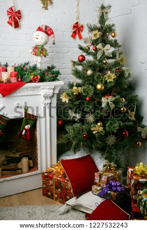 Image of chimney and decorated Christmas tree with gift Royalty-Free Stock Photo #1227532243