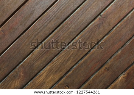 Diagonal Wooden Strips. Close up photography of brown wooden door texture.