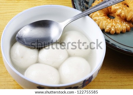 sweet dumplings in bowl on table Royalty-Free Stock Photo #122755585