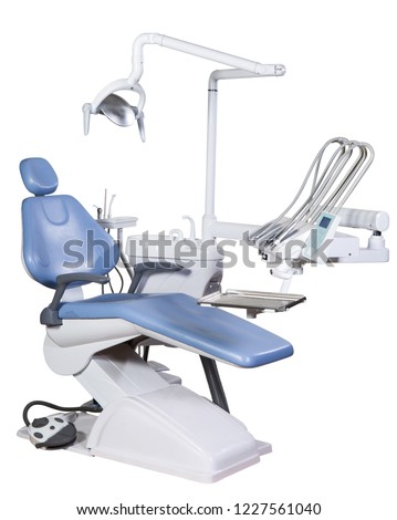 Modern medical special equipment - blue dentist chair isolated on white background Royalty-Free Stock Photo #1227561040