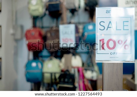 In Selective Focus of text 'SALE' at Summer Fast Discounts Zone in the Department Store Background.