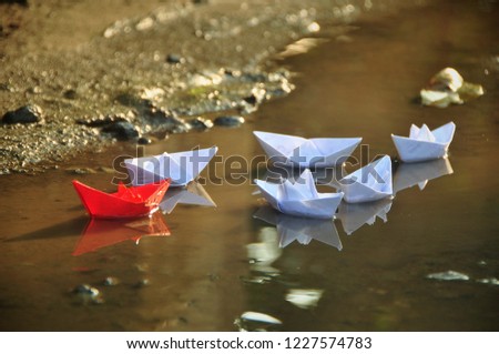 Leadership concept of team leader with paper boats Royalty-Free Stock Photo #1227574783