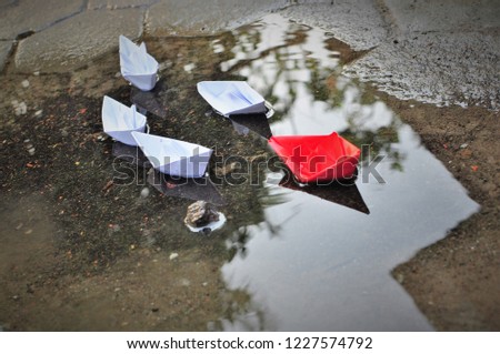 Leadership concept of team leader with paper boats Royalty-Free Stock Photo #1227574792