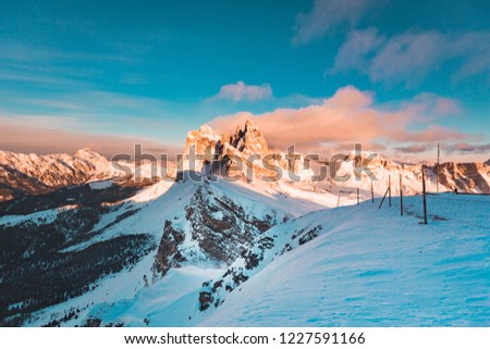 Classic view of famous Seceda mountain peaks in the Dolomites illuminated in beautiful evening light at sunset in winter, South Tyrol, Italy