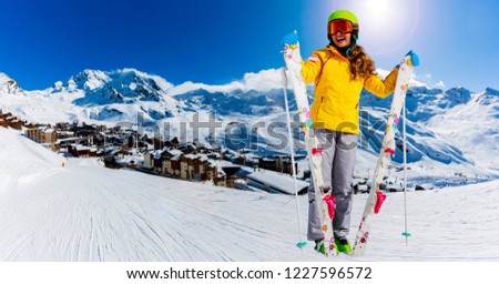 Ski teenager sporty girl having fun on winter vacation on the slope, Val Thorens, 3 Valleys, France.