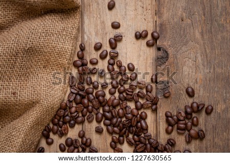 Chalkboard with coffee beans on wood and coffee grinder