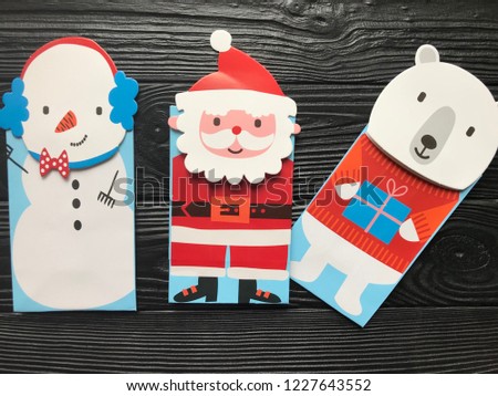 Santa claus,paper craft. Santa claus recycled papercraft wooden background. 
