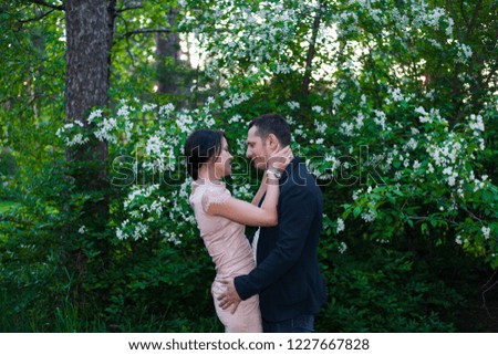 lovers hugging in the forest