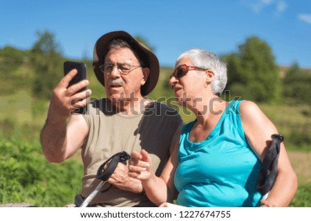 Senior couple on hike taking a selfie
