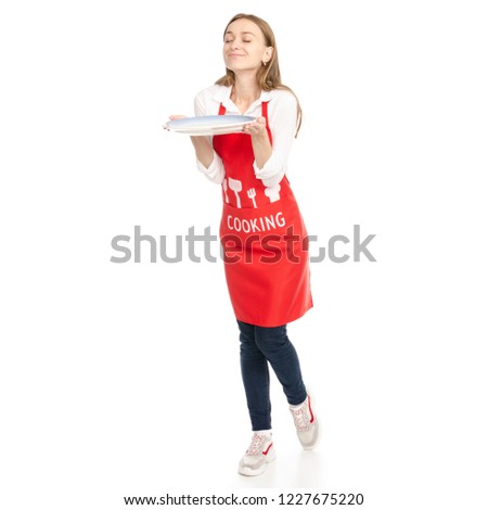 A woman in an apron in the hands of a dish on a white background. Isolation