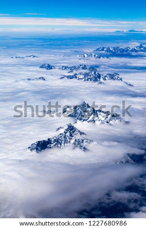 Aerial overlooking snowy mountains