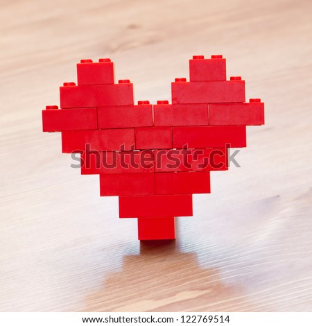 Red valentine heart giving with love Royalty-Free Stock Photo #122769514